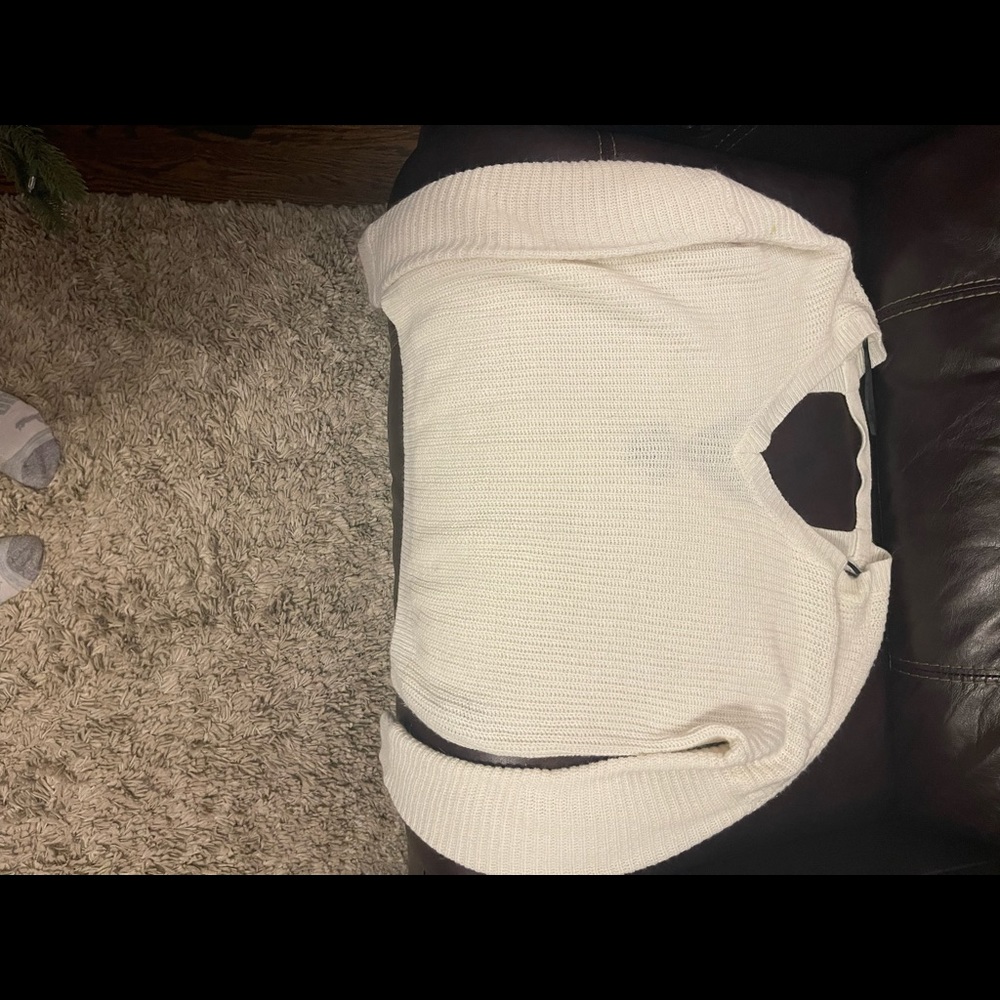 White sweater with low v back